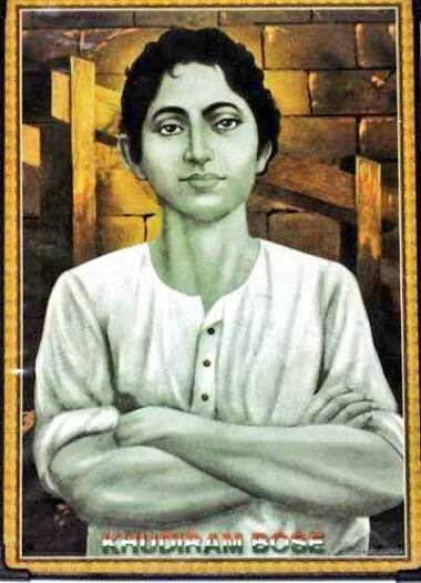Framed commemorative print of Khudiram Bose with folded arms, his name printed in the lower margin.